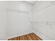 Empty walk-in closet featuring white wire shelving and wood-look flooring at 2585 Shellsburg Ave, Henderson, NV 89052