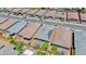A high angle capture of residential properties showing backyard landscaping, patios, and solar panels at 2767 Flowing Breeze St, Henderson, NV 89044