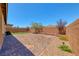 The backyard features a large patio, gravel landscaping, and privacy walls at 2767 Flowing Breeze St, Henderson, NV 89044