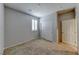 A carpeted bedroom offers a closet, a window with shutters, and neutral colored walls at 2767 Flowing Breeze St, Henderson, NV 89044