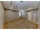 Spacious carpeted bedroom features a tray ceiling, recessed lighting, and a window with shutter, creating a comfortable retreat at 2767 Flowing Breeze St, Henderson, NV 89044