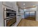Modern kitchen showcasing stainless steel built-in ovens and a stainless steel refrigerator at 2767 Flowing Breeze St, Henderson, NV 89044
