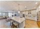Modern kitchen featuring a large island with seating, stainless steel appliances, and an open floor plan at 2767 Flowing Breeze St, Henderson, NV 89044