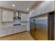 Well-equipped kitchen featuring stainless steel appliances and white countertops at 2767 Flowing Breeze St, Henderson, NV 89044
