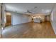 Spacious open-concept living room with wood floors, recessed lighting, and modern finishes at 2767 Flowing Breeze St, Henderson, NV 89044