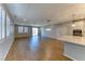 Spacious living room featuring plantation shutters, wood-look flooring, and recessed lighting at 2767 Flowing Breeze St, Henderson, NV 89044