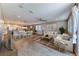 Open concept living space with modern furnishings, an island, and a dining area under recessed lighting at 2767 Flowing Breeze St, Henderson, NV 89044