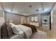 Cozy main bedroom with neutral tones, recessed lighting, a tray ceiling and an ensuite bathroom at 2767 Flowing Breeze St, Henderson, NV 89044