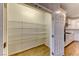 Walk-in pantry offers ample storage space with white wire shelving and laminate flooring, conveniently located off the kitchen at 2767 Flowing Breeze St, Henderson, NV 89044