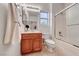Traditional bathroom design featuring a shower-tub combo and a wood vanity with a mirror at 2850 Thunder Bay Ave, Henderson, NV 89052
