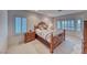 Charming bedroom with a decorative wooden bed frame, bright natural light, and neutral color palette at 2850 Thunder Bay Ave, Henderson, NV 89052