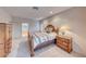 Comfortable bedroom featuring a decorative bed frame, plush carpet, and ample natural light at 2850 Thunder Bay Ave, Henderson, NV 89052