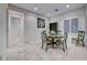 Cozy dining area with green accents and ample natural light from the window at 2850 Thunder Bay Ave, Henderson, NV 89052