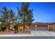 Charming single-story home with desert landscaping, mature trees, and a two-car garage at 2850 Thunder Bay Ave, Henderson, NV 89052