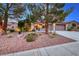 Well-maintained desert landscaping and charming courtyard adorn the front of this house at 2850 Thunder Bay Ave, Henderson, NV 89052