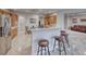 Kitchen featuring stainless steel appliances, breakfast bar, and tile flooring at 2850 Thunder Bay Ave, Henderson, NV 89052
