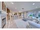 Bright living room with fireplace, bar seating and view to outdoor patio at 2850 Thunder Bay Ave, Henderson, NV 89052