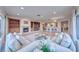 Bright living area with tile floors, fireplace, comfortable sofas, and expansive windows with view at 2850 Thunder Bay Ave, Henderson, NV 89052