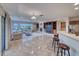 Bright living area with tile floors, fireplace, comfortable sofas, and expansive windows at 2850 Thunder Bay Ave, Henderson, NV 89052