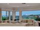 Bright living area with tile floors, comfortable sofas, and large windows offering outdoor views at 2850 Thunder Bay Ave, Henderson, NV 89052