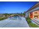 Home with concrete patio, furniture, mature landscaping, and outdoor views of the city and mountains at 2850 Thunder Bay Ave, Henderson, NV 89052