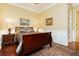Cozy bedroom with wood floors, a ceiling fan, and a decorative window at 2859 Hayden Creek Ter, Henderson, NV 89052