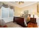 Cozy bedroom with wood floors, a ceiling fan, and a decorative window at 2859 Hayden Creek Ter, Henderson, NV 89052