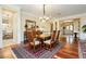 Elegant dining room with hardwood floors, stylish chandelier, and traditional furnishings at 2859 Hayden Creek Ter, Henderson, NV 89052