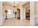 Elegant foyer with tile flooring, decorative chandelier, and classic furnishings at 2859 Hayden Creek Ter, Henderson, NV 89052