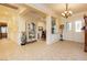 Inviting foyer featuring tile floors, crown molding, and elegant chandelier at 2859 Hayden Creek Ter, Henderson, NV 89052