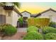Close up of the front entrance featuring secure gate and desert landscaping at 2859 Hayden Creek Ter, Henderson, NV 89052