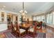 Open-concept living and dining area with hardwood floors and natural lighting at 2859 Hayden Creek Ter, Henderson, NV 89052