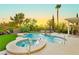Sparkling swimming pool and spa surrounded by lush landscaping and mature trees at 2859 Hayden Creek Ter, Henderson, NV 89052