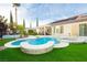 Enjoy the outdoors in this backyard with a sparkling swimming pool, spa, and patio area at 2859 Hayden Creek Ter, Henderson, NV 89052