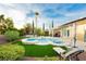 Enjoy the outdoors in this backyard with a sparkling pool and a relaxing lounge chair at 2859 Hayden Creek Ter, Henderson, NV 89052
