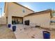 Spacious backyard with covered patio and desert landscaping for low maintenance at 3232 Romanesque Art Ave, Henderson, NV 89044