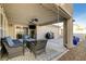 Covered patio area with comfortable seating and a well-maintained patio at 3232 Romanesque Art Ave, Henderson, NV 89044