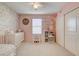 Bedroom with pink walls, floral wallpaper, a dollhouse, and white furniture at 3232 Romanesque Art Ave, Henderson, NV 89044
