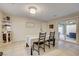 Cozy dining room with tile flooring and sliding glass doors to the outdoor patio, perfect for entertaining and everyday meals at 3232 Romanesque Art Ave, Henderson, NV 89044
