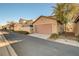 Home exterior showing a garage and well-maintained landscaping at 3232 Romanesque Art Ave, Henderson, NV 89044