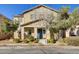 Inviting two-story home featuring well-maintained landscaping and a charming front entrance with a blue door and seasonal wreath at 3232 Romanesque Art Ave, Henderson, NV 89044