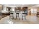 Spacious kitchen with dark wood cabinetry, granite countertops, and stainless steel appliances at 3232 Romanesque Art Ave, Henderson, NV 89044