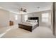 Spacious main bedroom with three large windows providing natural light and carpet flooring at 3232 Romanesque Art Ave, Henderson, NV 89044
