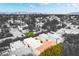 An aerial, partially desaturated, view focuses on a neighborhood street, highlighting community elements and surroundings at 3306 Brookfield Dr, Las Vegas, NV 89120