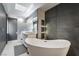 Luxurious bathroom featuring a freestanding tub, double sink vanity, and modern fixtures at 3306 Brookfield Dr, Las Vegas, NV 89120