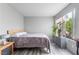 Bright bedroom with natural light showcasing a minimalist design and views to the outdoors at 3306 Brookfield Dr, Las Vegas, NV 89120