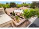 An aerial view showcases a landscaped yard with a charming house, a lovely courtyard, and manicured gardens at 3306 Brookfield Dr, Las Vegas, NV 89120