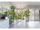 Bright sunroom filled with natural light, plants, and a view of the outdoors at 3306 Brookfield Dr, Las Vegas, NV 89120