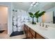 A well-lit bathroom with a double vanity, modern fixtures, and a relaxing ambiance at 3728 Granada Gorge Ln, North Las Vegas, NV 89084