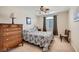 This is a standard bedroom with carpet, a ceiling fan, and a large window at 3728 Granada Gorge Ln, North Las Vegas, NV 89084